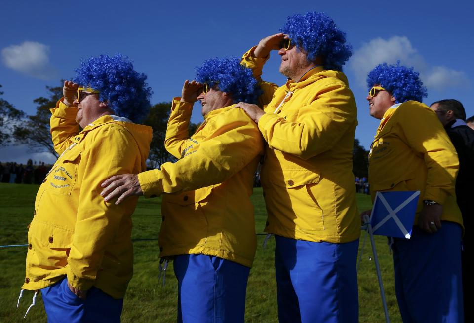 Swedish golf fans watch European Ryder Cup player Henrik Stenson during his fourballs 40th Ryder Cup match at Gleneagles in Scotland September 26, 2014. REUTERS/Eddie Keogh (BRITAIN - Tags: SPORT GOLF TPX IMAGES OF THE DAY)