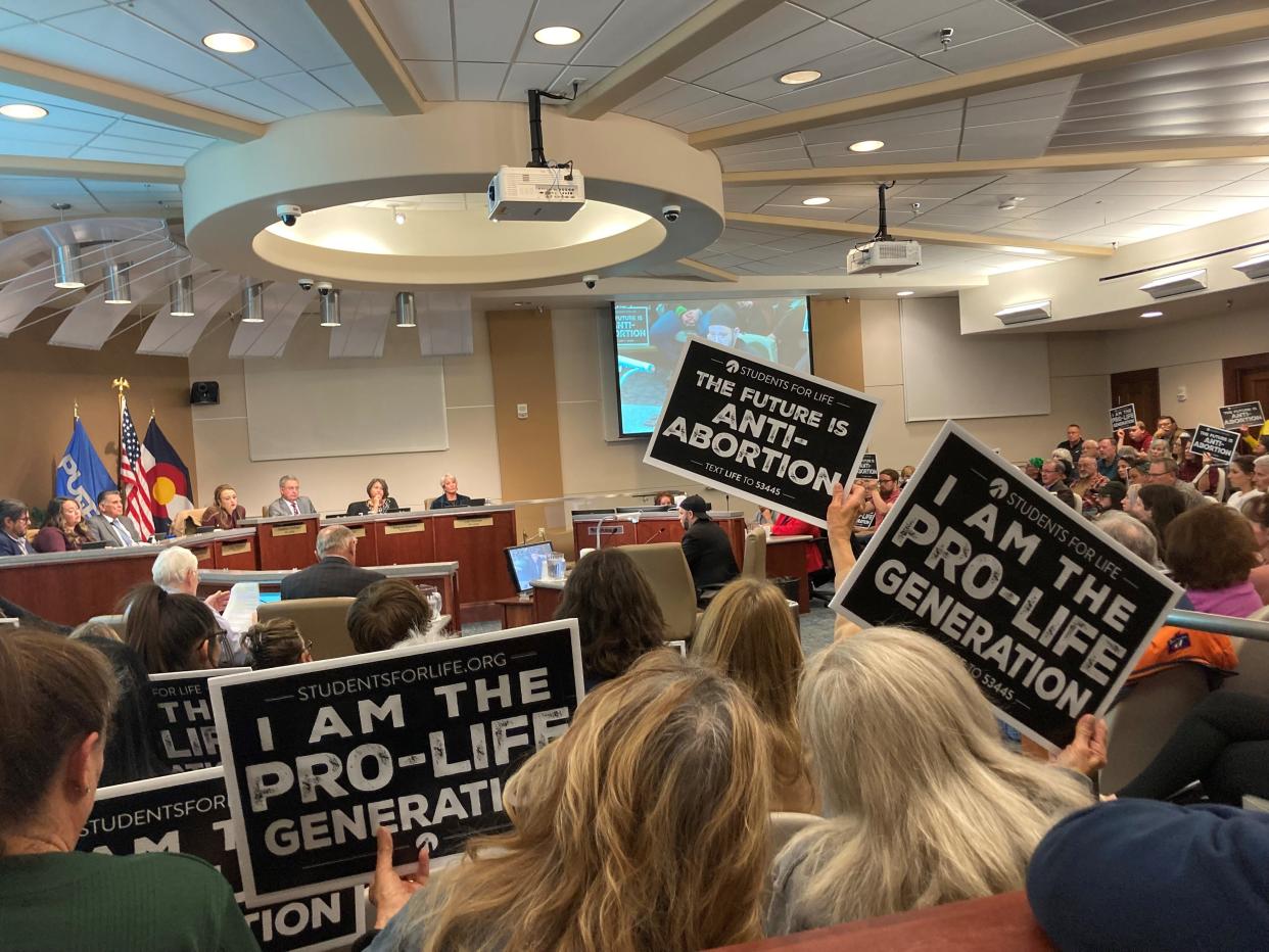 Many attendees at the Pueblo City Council meeting on Nov. 28 brandished signs distributed by Students for Life, a national anti-abortion organization with chapters at thousands of schools around the country.