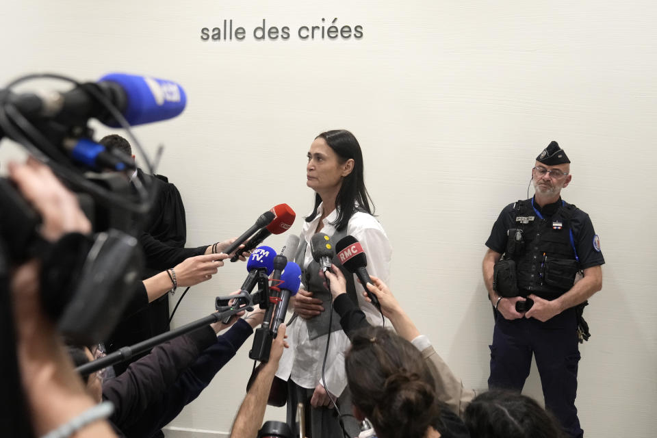 British actor Charlotte Lewis leaves the courtroom after the verdict against filmmaker Roman Polanski Tuesday, May 14, 2024 in Paris. Roman Polanski was acquitted of defaming the actor whom he described as a liar after she accused the director of sexual assault. (AP Photo/Thibault Camus)