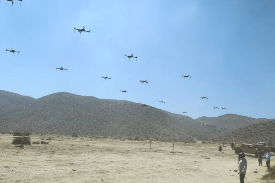 Elements of a 40-drone swarm provided via the Threat Systems Management Office take off at the US Army’s National Training Center in California during an exercise in 2019. <em>US Army / Pv2 James Newsome</em> A drone swarm exercise being held at the NTC. <em>Credit:</em> <em>U.S. Army/Pv2 James Newsome</em>