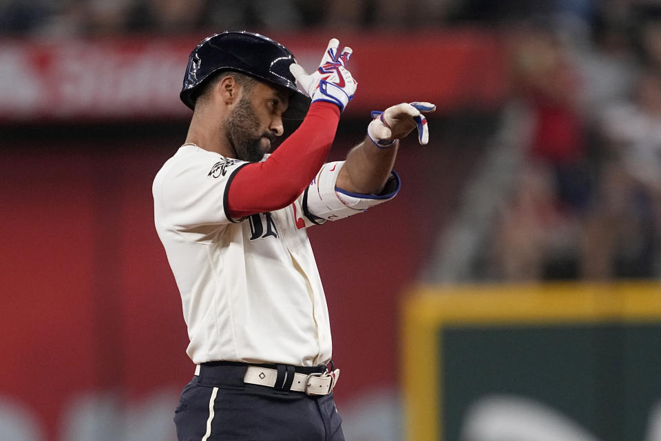 Texas Rangers' Marcus Semien celebrates after hitting a double in the first inning of a baseball game against the Minnesota Twins, Saturday, Sept. 2, 2023, in Arlington, Texas. (AP Photo/Tony Gutierrez)