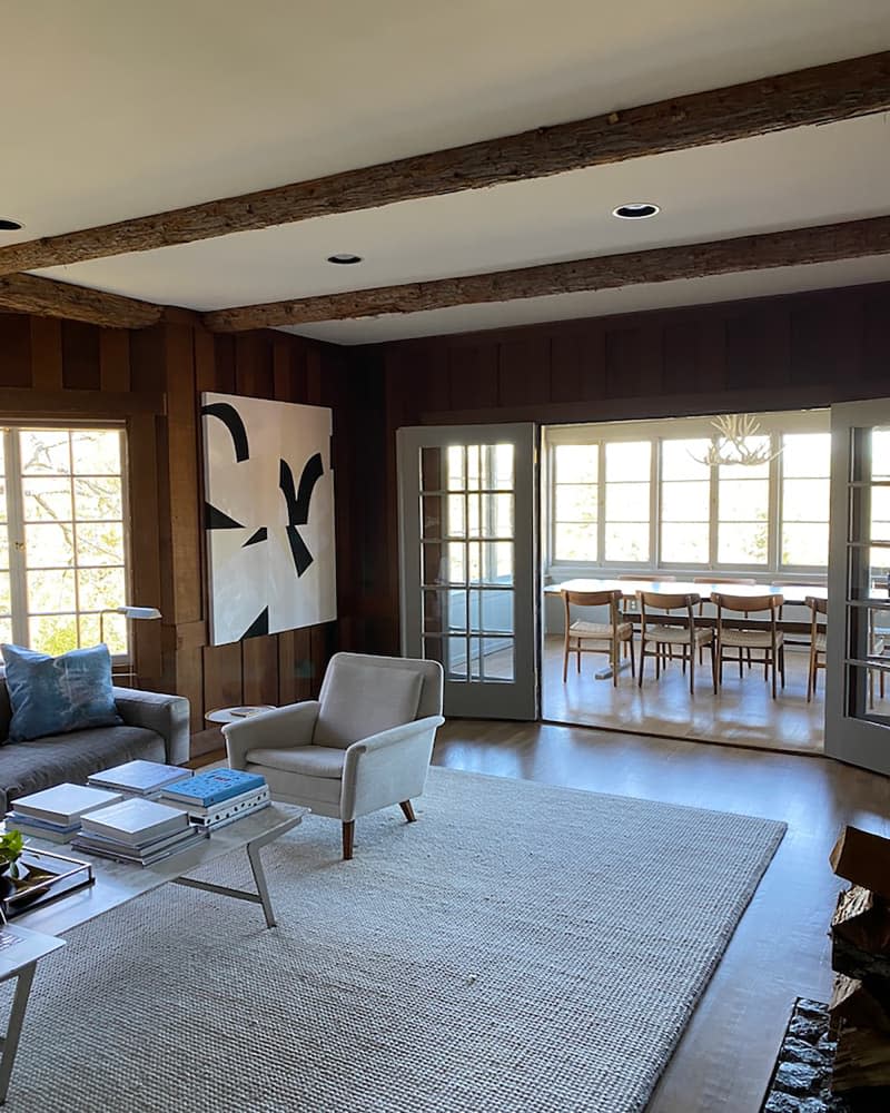 White armchair in living room before renovation.