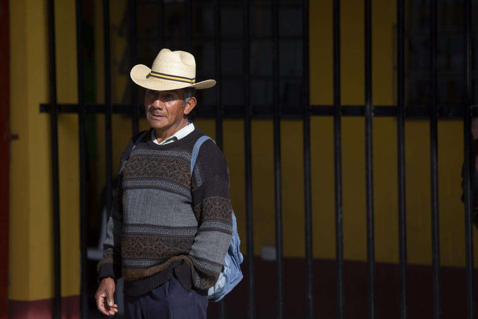 A man waits to casts his votes at a polling station in Sumpango, Guatemala, Sunday, June 16, 2019. Guatemalans are voting for their next president Sunday in elections plagued by widespread disillusion and distrust, and as thousands of their compatriots flee poverty and gang violence to seek a new life in the United States. (AP Photo/Moises Castillo)