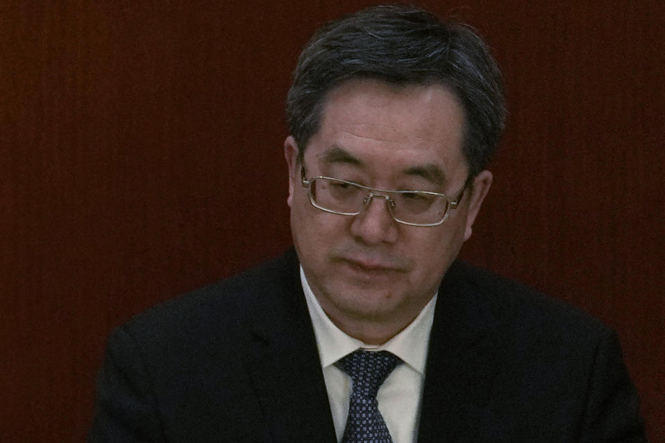 Politburo Standing Committee member Ding Xuexiang attends a session of China's National People's Congress (NPC) at the Great Hall of the People in Beijing, Tuesday, March 7, 2023. As director of the party's General Office since 2017, Ding Xuexiang has effectively served as Chinese leader Xi Jinping's chief of staff, notably present on state visits and meetings with foreign leaders. Like Wang, Ding has never held government office but sits at the center of party affairs just below the Politburo. (AP Photo/Ng Han Guan)