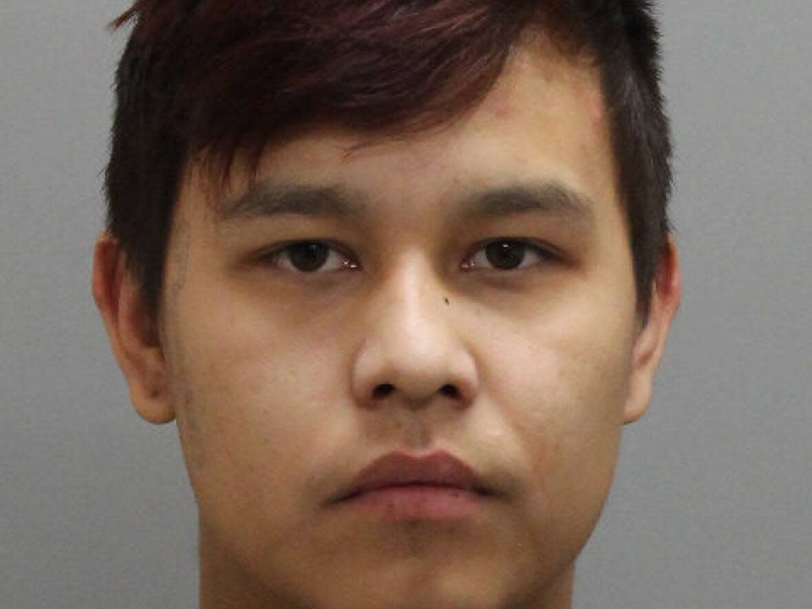 A warrant has been issued for Javon Moosomin's arrest. He should be considered armed and dangerous, RCMP say. (RCMP - image credit)