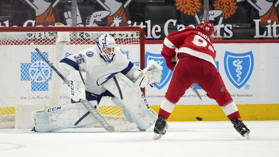 Detroit Red Wings center Sam Gagner (89) scores a shootout goal against Tampa Bay Lightning goaltender Curtis McElhinney (35) in an NHL hockey game Saturday, May 1, 2021, in Detroit. Detroit won 1-0. (AP Photo/Paul Sancya)