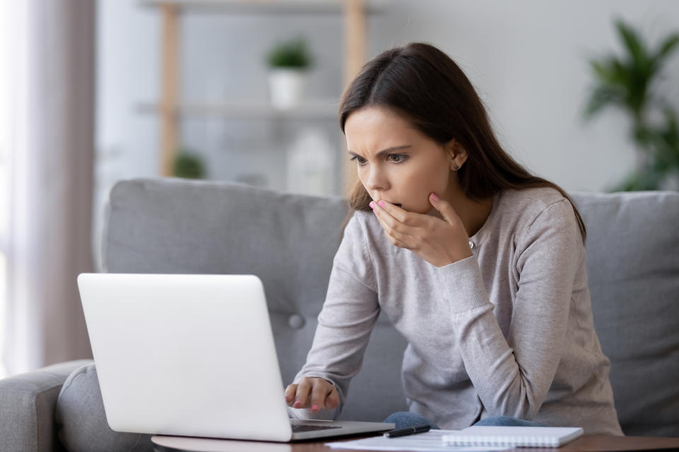 Shocked stressed young woman reading bad online news looking at broken laptop screen, confused teen girl in panic frustrated with stuck computer problem mistake virus, negative social media message