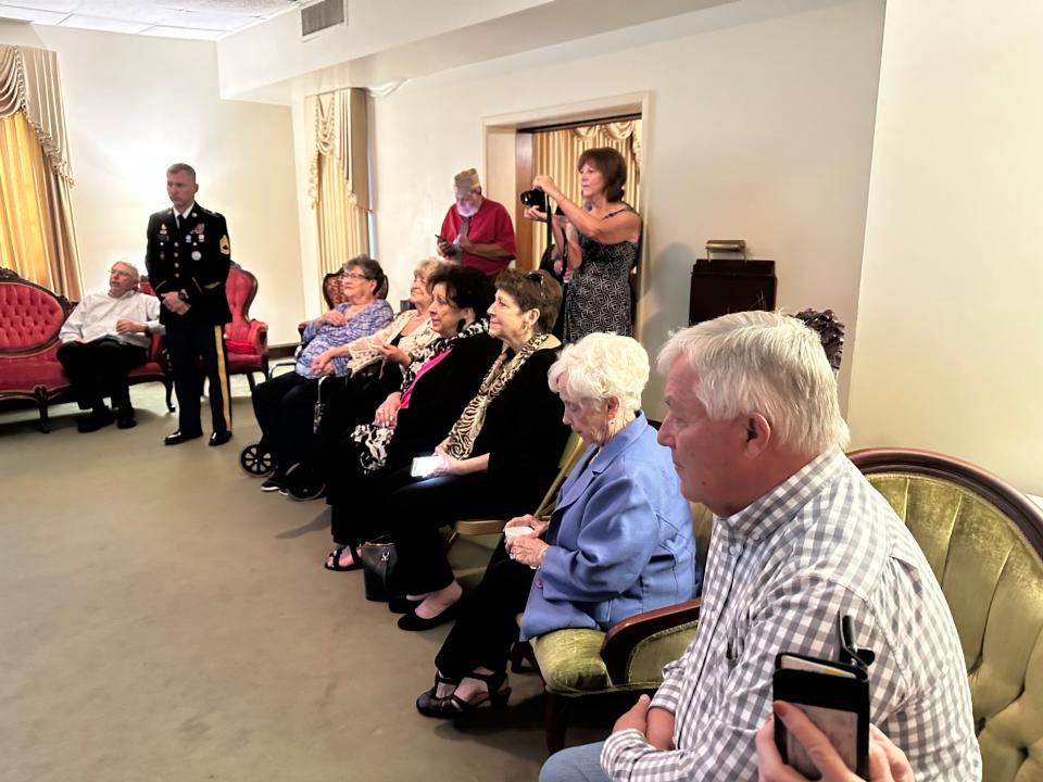 Family members of Theodore Scarborough participate in a medal presentation during a service at Hulett-Winstead Funeral Home in Hattiesburg, Miss., Friday, April 21, 2023. Scarborough's remains were returned to Mississippi 80 years after he was killed in World War II.