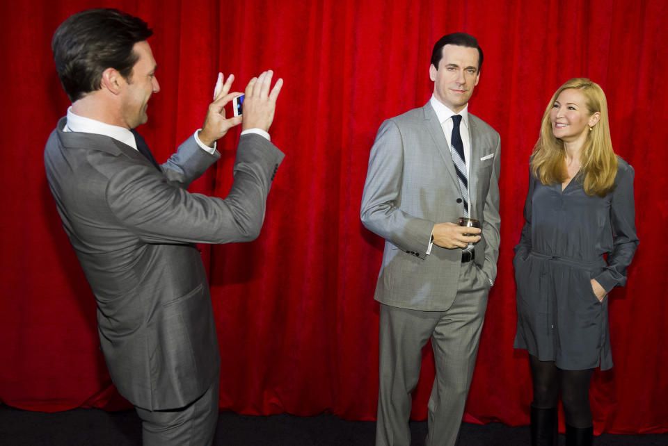 Jon Hamm, left, and Jennifer Westfeldt attend the unveiling of his wax figure at Madame Tussauds on Friday, May 9, 2014 in New York. (Photo by Charles Sykes/Invision/AP)