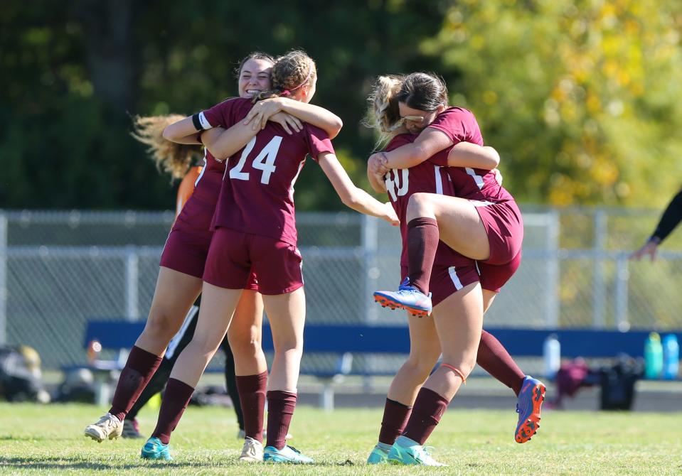 Faith Christian Eagles players celebrate after they won the IHSAA girls soccer sectional against Central Catholic Knights, Saturday, Oct. 8, 2022, at Central Catholic High School in Lafayette, Ind. Faith Christian won 2-1.