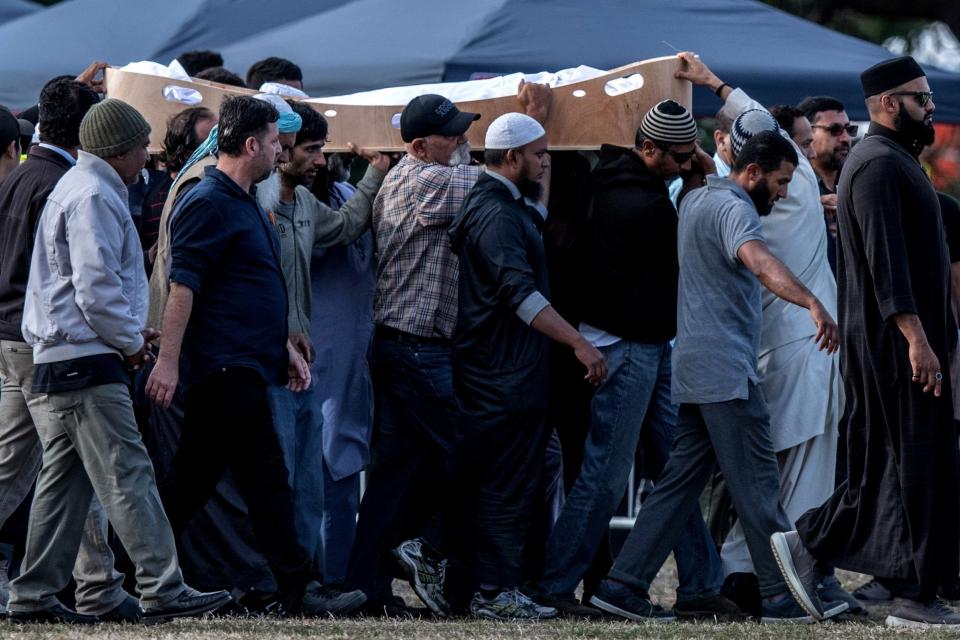 A coffin containing the body of a victim of the Christchurch terrorist attack is carried for burial at Memorial Park Cemetery. (Getty Images)