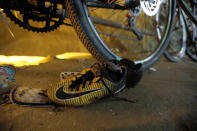 <p>Soccer shoes and bicycles left by a group of missing boys are seen at the entrance of a deep cave in Chiang Rai Province, northern Thailand, on June 25, 2018. Officials say multiple attempts to locate the 12 boys and their soccer coach missing in a flooded cave in northern Thailand for nearly two days have failed, but they will keep trying. (Photo: Thai News pix via AP) </p>