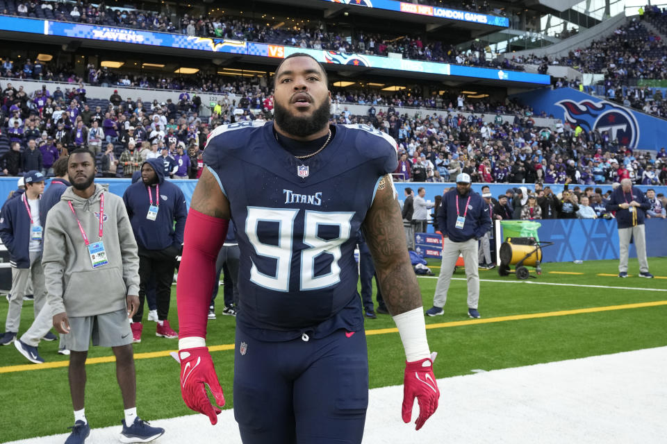 Tennessee Titans defensive tackle Jeffery Simmons (98) walks across the field before an NFL football game against the Baltimore Ravens, Sunday, Oct. 15, 2023, at the Tottenham Hotspur stadium in London. (AP Photo/Kin Cheung)