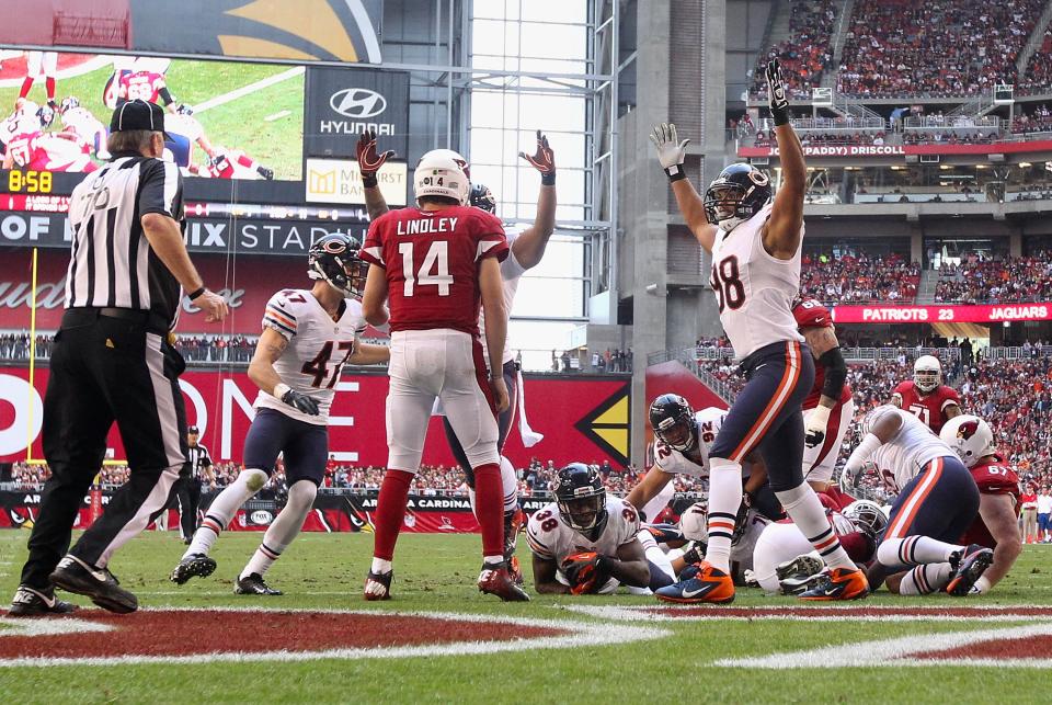 Defensive end Corey Wootton #98 of the Chicago Bears celebrates after defensive back Zack Bowman #38 scored a 1 yard touchdown on a fumble recovery against the Arizona Cardinals during the first quarter of the NFL game at the University of Phoenix Stadium on December 23, 2012 in Glendale, Arizona. (Photo by Christian Petersen/Getty Images)