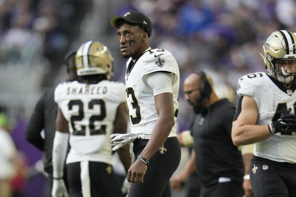 New Orleans Saints wide receiver Michael Thomas (13) watches from the sideline during the second half of an NFL football game against the Minnesota Vikings Sunday, Nov. 12, 2023, in Minneapolis. (AP Photo/Abbie Parr)