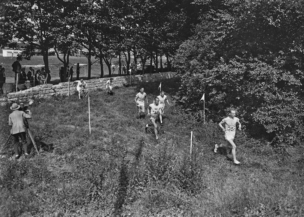 Paavo Nurmi ahead of Edvin Wide with Ville Ritola in rear during men's individual cross country event.