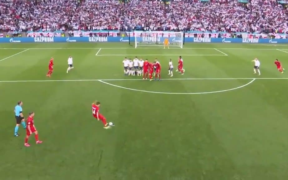 Denmark players encroaching the England wall as Damsgaard strikes the ball - ITV/UEFA