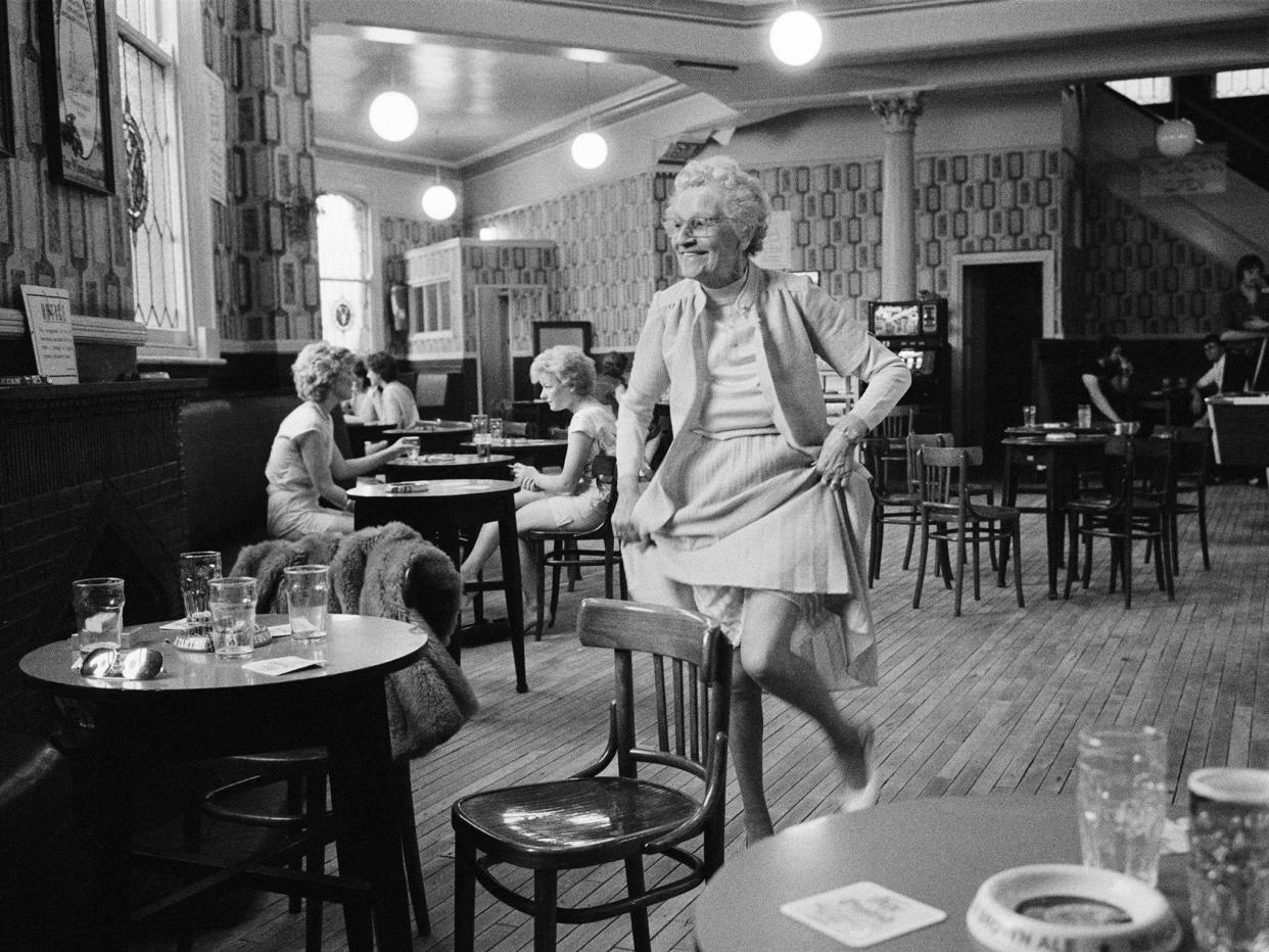 Knees up at Yates's Wine Lodge, in Ashton-Under-Lyne: these lodges had a dismal reputation, seemingly designed for taking the quickest route to oblivion: Martin Parr/Magnum Photos