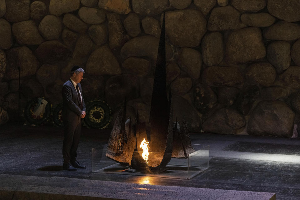 German Vice Chancellor and Economy and Climate Minister Robert Habeck, rekindles the Eternal Flame in the Hall of Remembrance at the Yad Vashem World Holocaust Remembrance Center in Jerusalem, Tuesday, June 7, 2022. (AP Photo/Tsafrir Abayov)