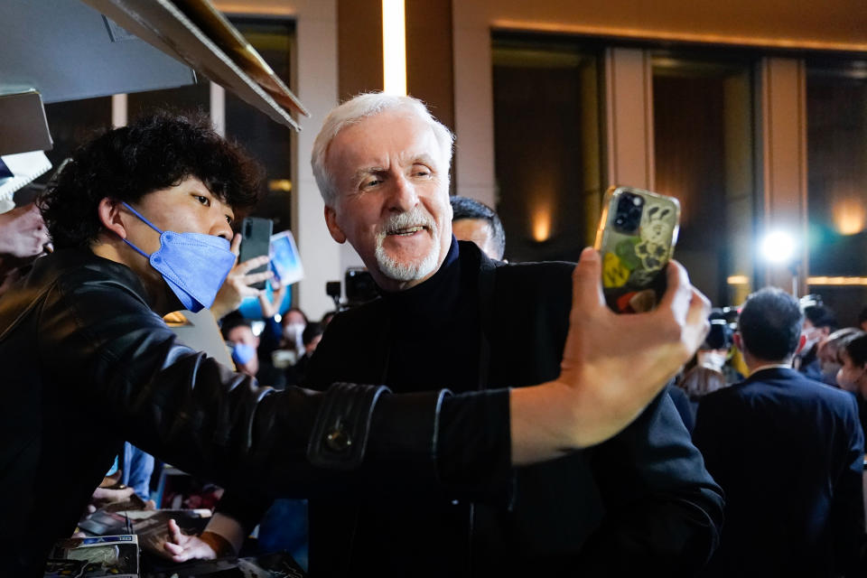 TOKYO, JAPAN – DECEMBER 10: James Cameron takes a selfie with a fan during the “Avatar: The Way of Water” Japan Premiere at TOHO Cinemas Hibiya on December 10, 2022 in Tokyo, Japan. (Photo by Christopher Jue/Getty Images for Disney)