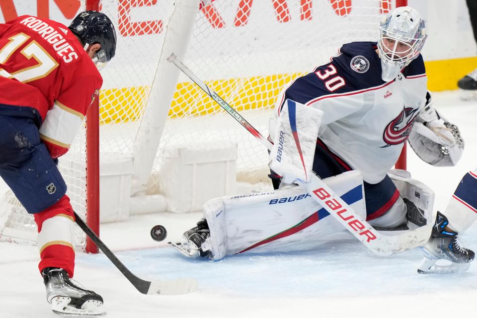 Florida Panthers center Evan Rodrigues (17) attempts a shot at Columbus Blue Jackets goaltender Spencer Martin (30) during the third period of an NHL hockey game, Monday, Nov. 6, 2023, in Sunrise, Fla. (AP Photo/Wilfredo Lee)
