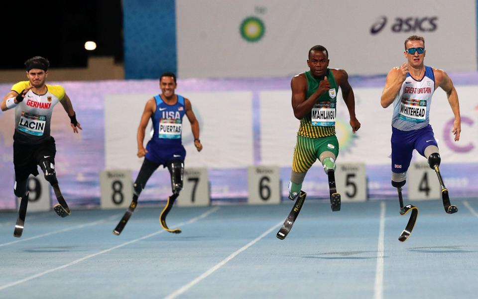 Richard Whitehead, right, came second in the men's 200m T61 at the World Para Athletics Championships - REX