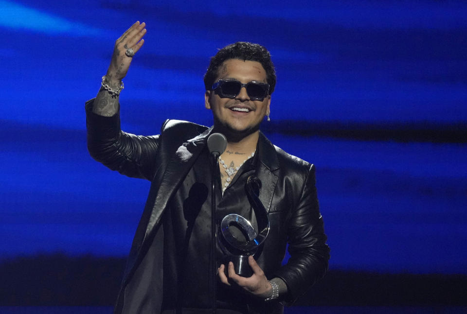 Christian Nodal accepts the award for regional Mexican artist of the year at Premio Lo Nuestro at FTX Arena in Miami on Thursday, Feb. 24, 2022. (AP Photo/Rebecca Blackwell)