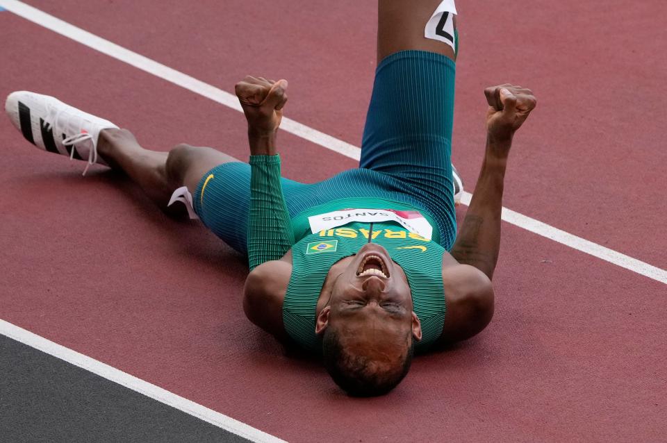 Alison Dos Santos, of Brazil celebrates taking the bronze medal in the final of the men's 400-meter hurdles at the 2020 Summer Olympics, Tuesday, Aug. 3, 2021, in Tokyo, Japan. 