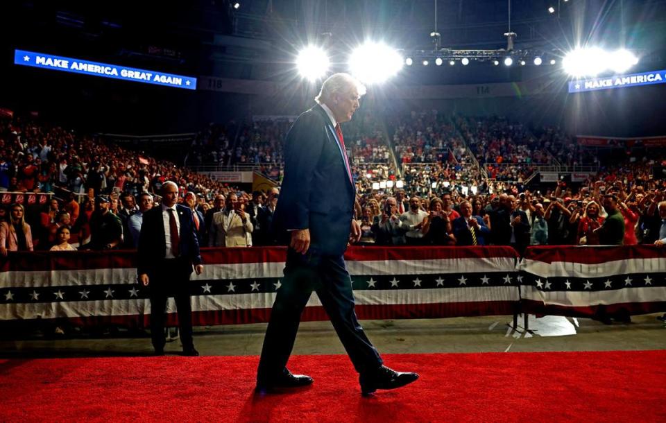 Former President Donald Trump walks to the podium to speak as supporters cheer at Bojangles Coliseum in Charlotte, NC on Wednesday, July 24, 2024.