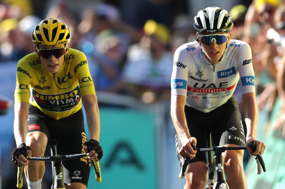 Jumbo-Visma's Danish rider Jonas Vingegaard wearing the overall leader's yellow jersey (L) and UAE Team Emirates' Slovenian rider Tadej Pogacar wearing the best young rider's white jersey cycle to the finish line of the 15th stage of the 110th edition of the Tour de France cycling race, 179 km between Les Gets Les Portes du Soleil and Saint-Gervais Mont-Blanc, in the French Alps, on July 16, 2023. (Photo by Thomas SAMSON / AFP)