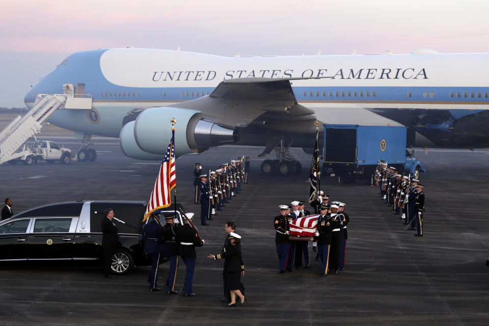 The flag-draped casket of former President George H.W. Bush is carried by a joint services military honor guard Wednesday, Dec. 5, 2018, at Ellington Field in Houston. (Photo: Eric Gay/AP)