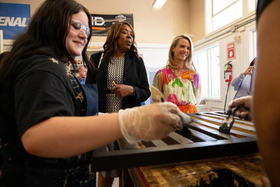 First Partner Jennifer Siebel Newsom, right, and Washington Unified School District Superintendent Cheryl Hildreth, center, tour the Career Technical Education Pathways program at River City High School in West Sacramento on Thursday. Paul Kitagaki Jr./pkitagaki@sacbee.com