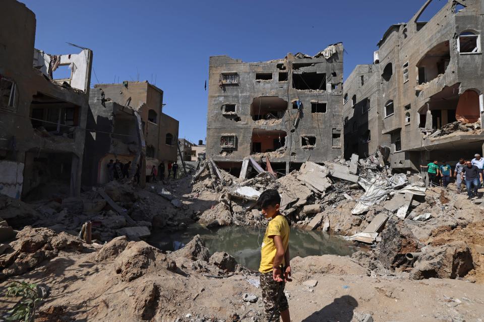 A Palestinian child stands amid the rubble of buildings, destroyed by Israeli strikes, in Beit Hanoun in the northern Gaza Strip on Friday. (Photo: EMMANUEL DUNAND/AFP via Getty Images)