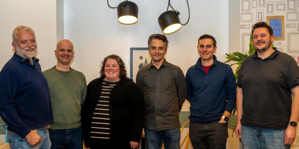 The founding team at Causal poses for a photo in an office setting.