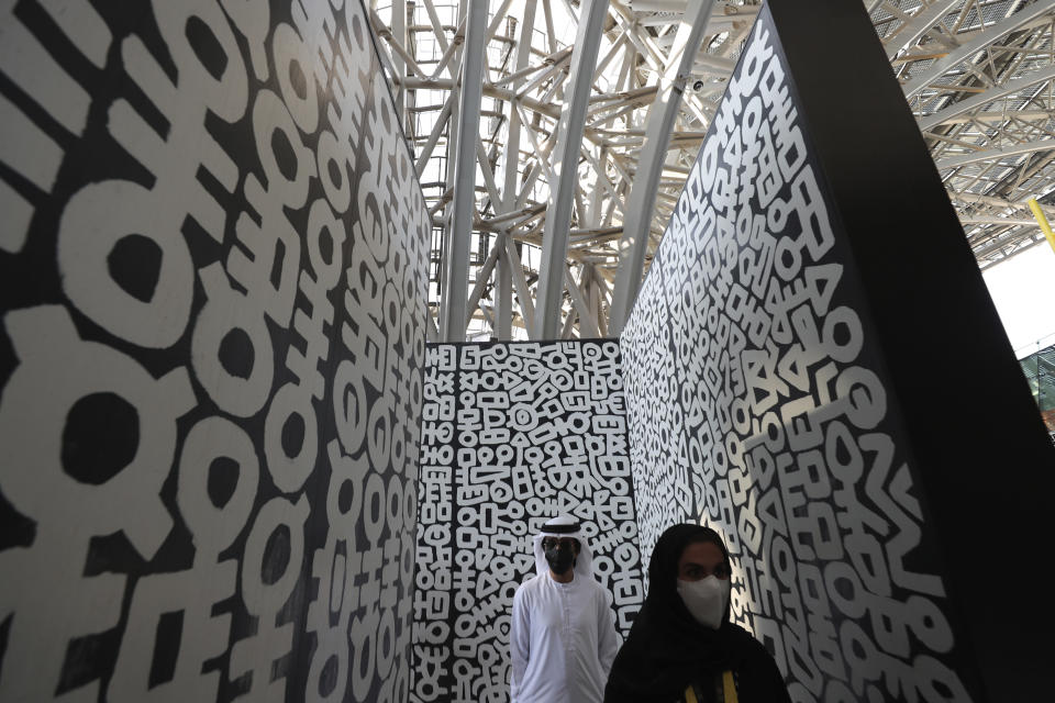 Journalists visit Terra, The Sustainability Pavilion, during a media tour at the Dubai World Expo site in Dubai, United Arab Emirates, Saturday, Jan. 16, 2021. With the inauguration of Expo 2020 Dubai, the next world's fair, nine months away amid the raging global pandemic that forced its postponement, organizers unveiled the site's signature pavilion to reporters for the first time on Saturday. (AP Photo/Kamran Jebreili)