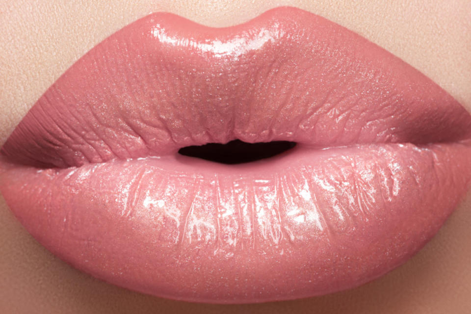If you're tired of having thin, pursed puckers, extend your lip line using a neutral-toned lip liner. Then apply lipstick over top. Be careful though — don't extend your lip line too much. 