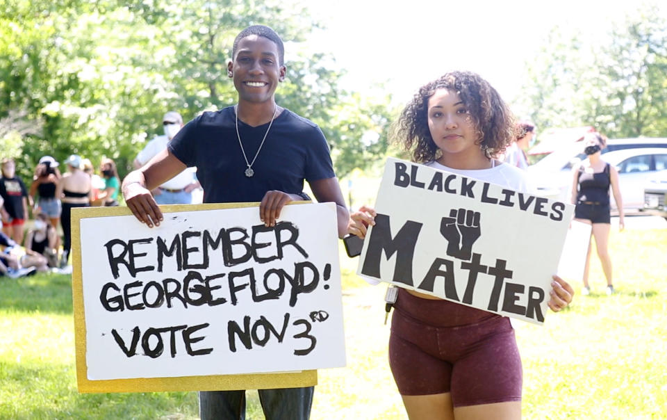 Geoffrey Preuehomme of Radford, left, and Brianna Johnson of Roanoke attend a rally at Washington Park organized by the local Black Lives Matter chapter on Saturday. Hundreds of protesters came out for the event on Saturday May 30, 2020.(Heather Rousseau/The Roanoke Times via AP)