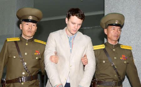 FILE PHOTO - Otto Frederick Warmbier (C), a University of Virginia student who was detained in North Korea since early January, is taken to North Korea's top court in Pyongyang, North Korea, in this photo released by Kyodo March 16, 2016. Mandatory credit REUTERS/Kyodo