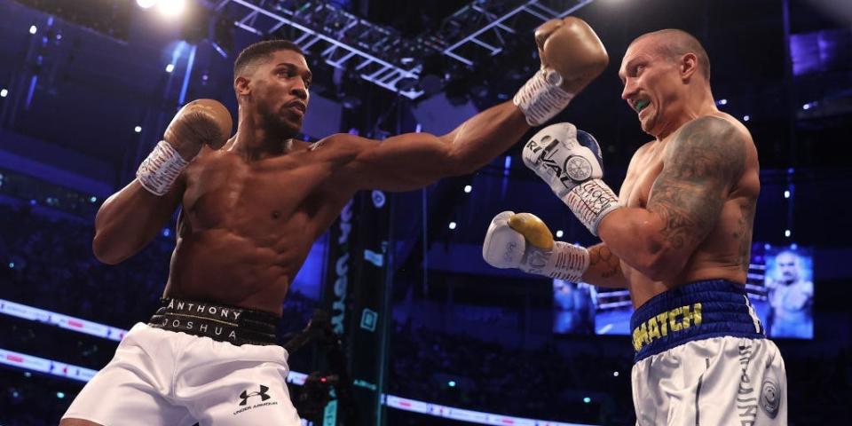 Boxer Anthony Joshua throws a punch towards Oleksandr Usyk