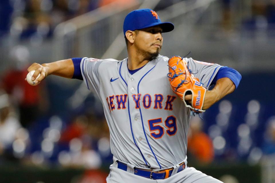 New York Mets starting pitcher Carlos Carrasco (59) delivers a pitch during the first inning against the Miami Marlins at loanDepot Park.