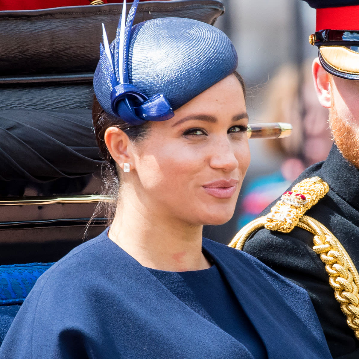 Meghan Markle looking devious blue outfit