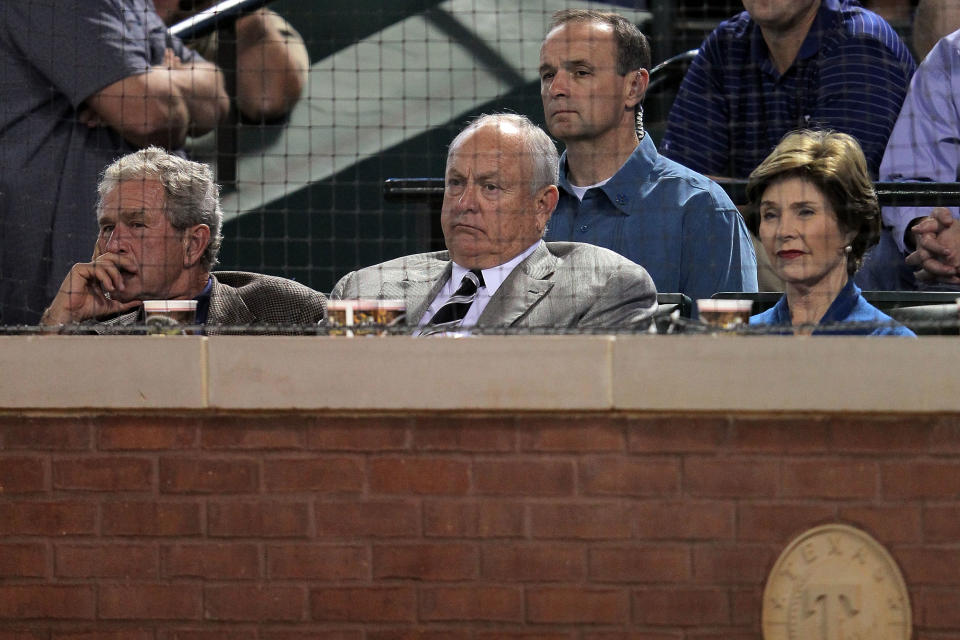 ARLINGTON, TX - OCTOBER 22: (L-R) Former President George W. Bush, Texas Rangers CEO and President Nolan Ryan and former first lady Laura Bush attend Game Three of the MLB World Series between the St. Louis Cardinals and the Texas Rangers at Rangers Ballpark in Arlington on October 22, 2011 in Arlington, Texas. (Photo by Doug Pensinger/Getty Images)