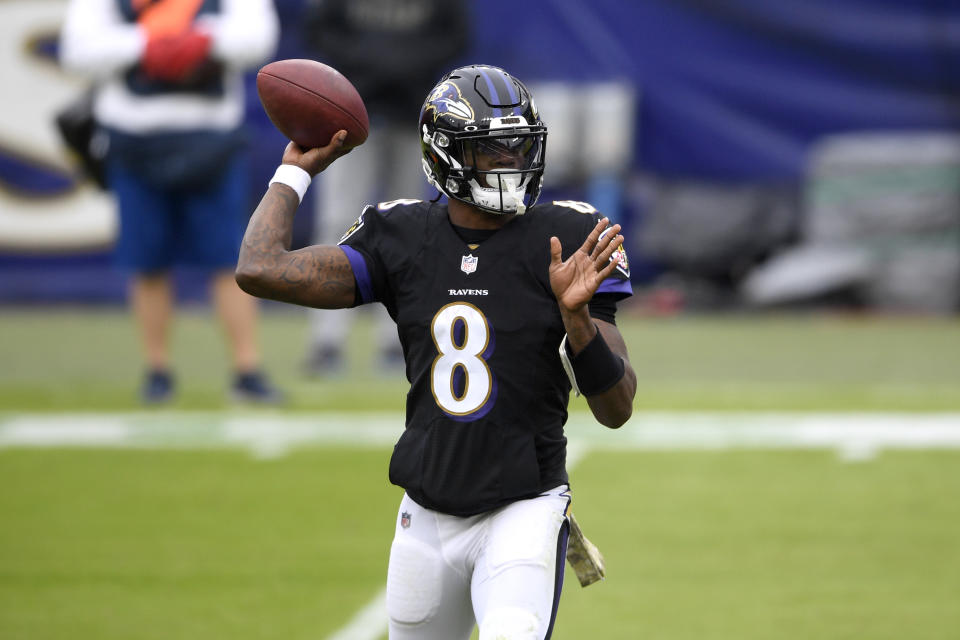 Baltimore Ravens quarterback Lamar Jackson throws a pass against the Tennessee Titans during the first half of an NFL football game, Sunday, Nov. 22, 2020, in Baltimore. (AP Photo/Nick Wass)