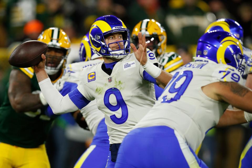 Los Angeles Rams quarterback Matthew Stafford throws a pass during the first half of an NFL football game against the Green Bay Packers Sunday, Nov. 28, 2021, in Green Bay, Wis.