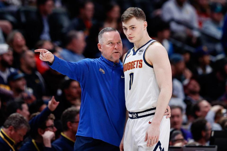 Denver Nuggets head coach Michael Malone talks with guard Christian Braun (0) in the fourth quarter against the New Orleans Pelicans at Ball Arena on March 30, 2023. Isaiah J. Downing/USA TODAY Sports