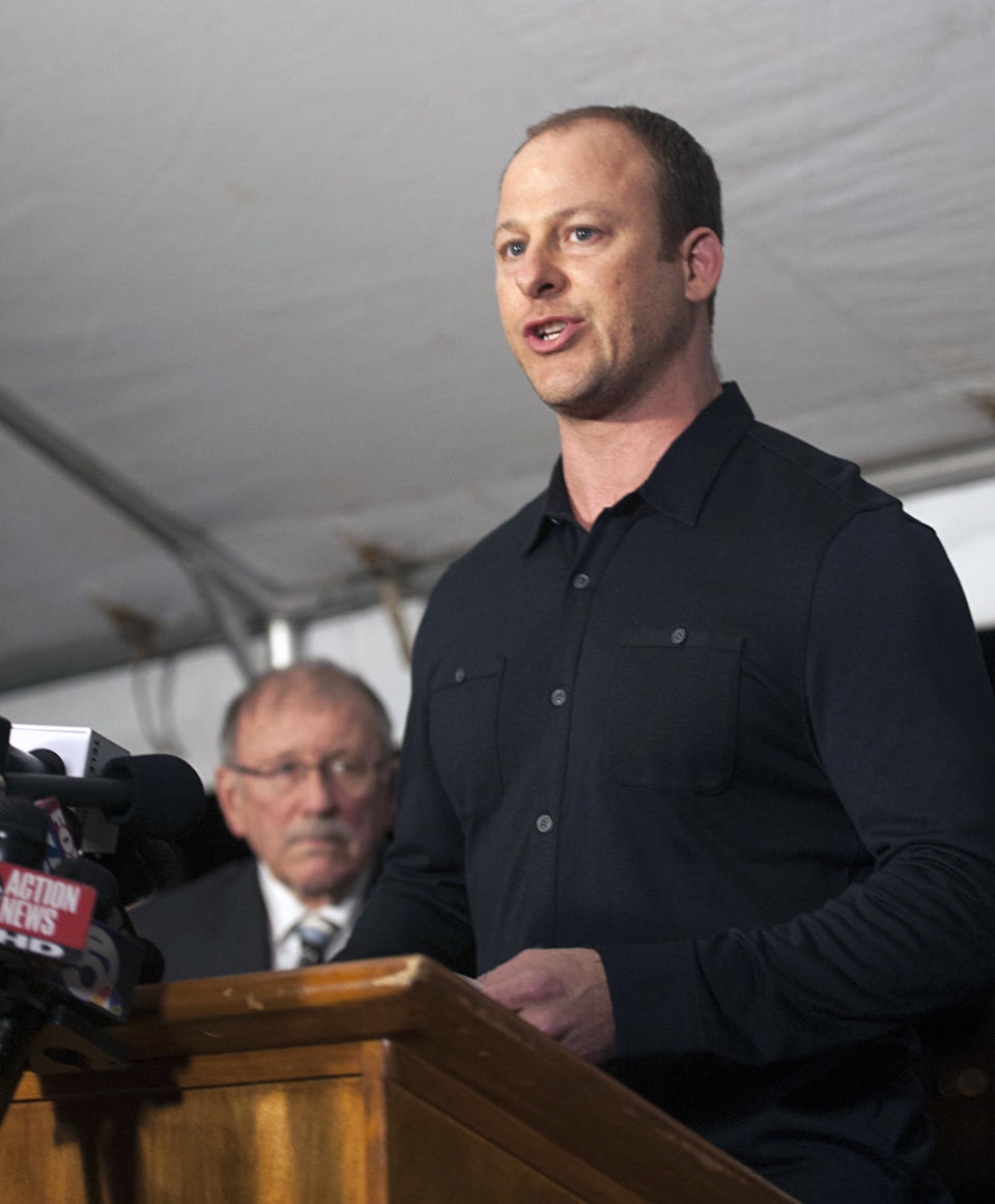 Ted Ryce, brother of slain Jimmy Ryce, right, reads a statement to the media as his father Don, left, listens following the execution of Juan Carlos Chavez, Wednesday, Feb. 12, 2014 at the Florida State Prison near Starke, Fla. Chavez was executed Wednesday night in Florida for raping and killing Jimmy Ryce a 9-year-old boy 18 years ago, a death that spurred the victim's parents to press nationwide for stronger sexual predator confinement laws and better handling of child abduction cases. (AP Photo/Phil Sandlin)