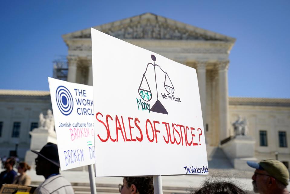 Protesters rally as the U.S. Supreme Court begins a new term on Oct. 2, 2023.