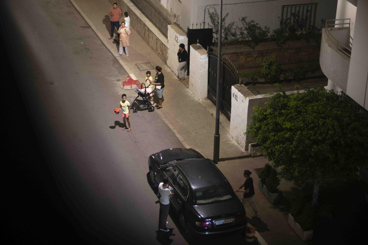 People take shelter outside their homes after an earthquake in Rabat, Morocco, Friday, Sept. 8, 2023. A powerful earthquake struck Morocco late Friday, damaging buildings in major cities and sending panicked people pouring into streets and alleyways from Rabat to Marrakech. (AP Photo/Mosa'ab Elshamy)