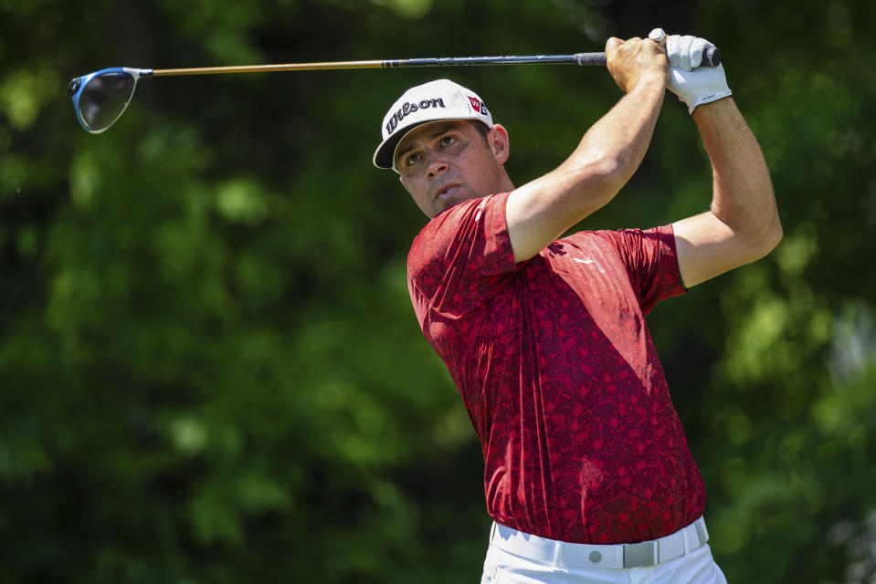 Gary Woodland watches his tee shot on the seventh hole during the fourth round of the Wells Fargo Championship golf tournament at Quail Hollow on Sunday, May 9, 2021, in Charlotte, N.C. (AP Photo/Jacob Kupferman)