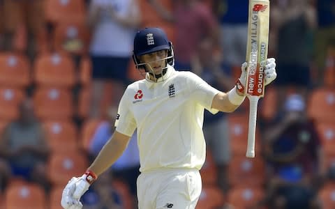 Joe Root raises his bat to the crowd after scoring a half-century - Credit: Getty images